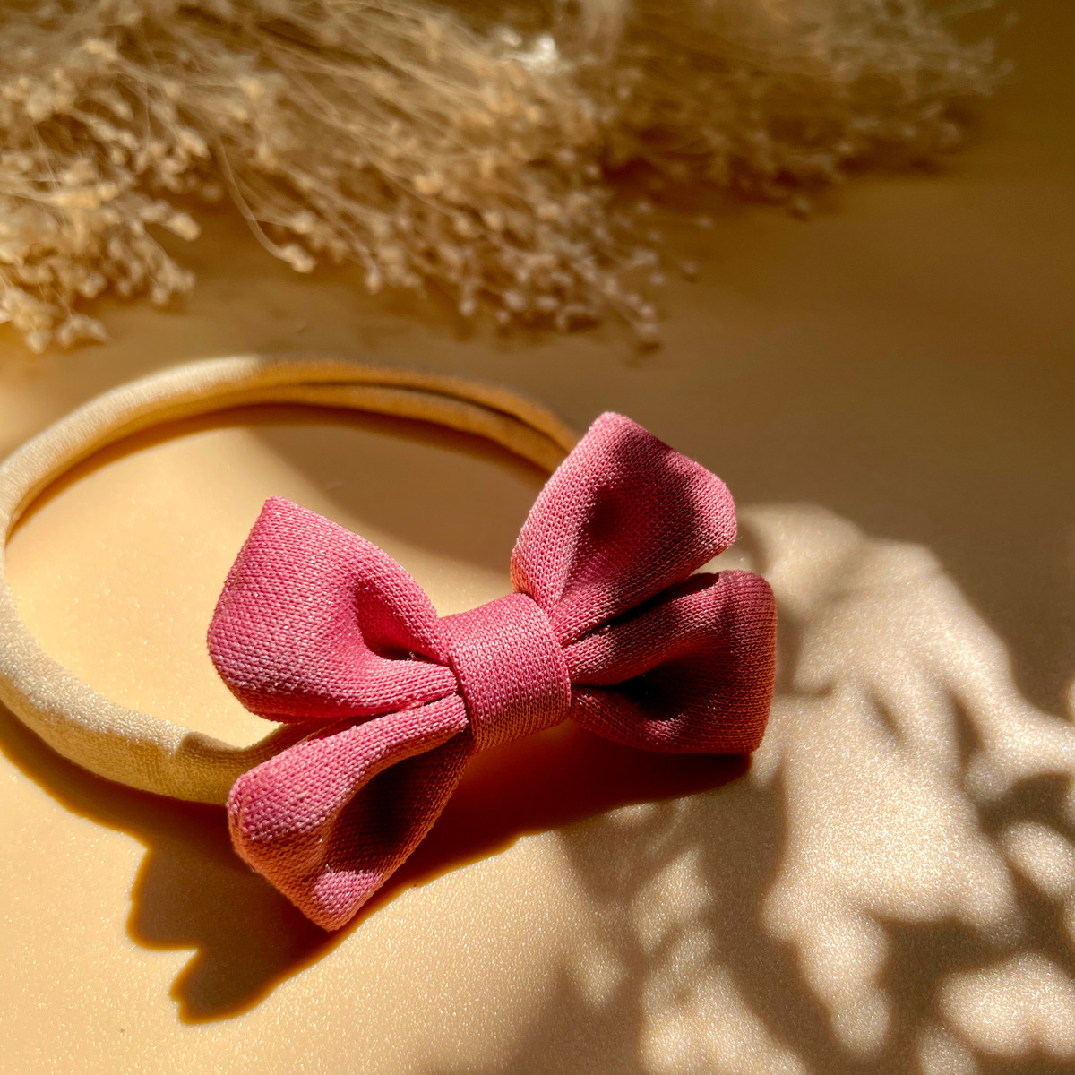 CERCHIETTO ELASTICO CON FIOCCO (Rosa Corallo)