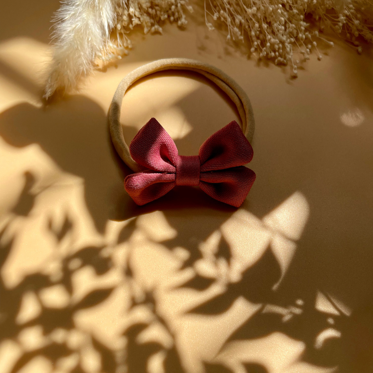 CERCHIETTO ELASTICO CON FIOCCO (Rosa Corallo)